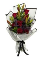 Valentine’s bouquet of red roses with lilies and limonium wrapped in white by Flowsent – flower delivery in Cairo and Giza