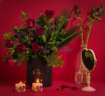 Elegant Valentine’s flower box with red roses, hypericum, lilies and limonium by Flowsent – flower delivery in Cairo and Giza